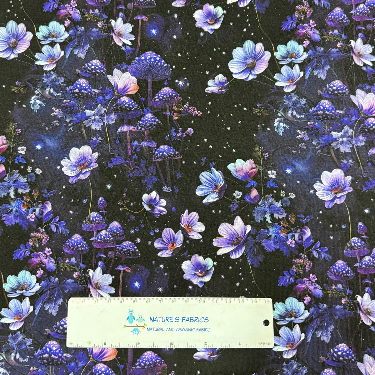 Nature's Fabrics: Purple floral and mushroom print on dark background, organic cotton fabric by yard