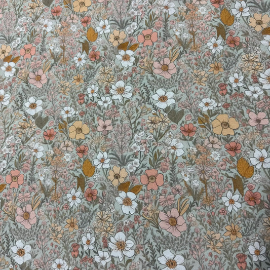 Nature's Fabrics vintage-style floral print fabric with white, pink, and yellow flowers.
