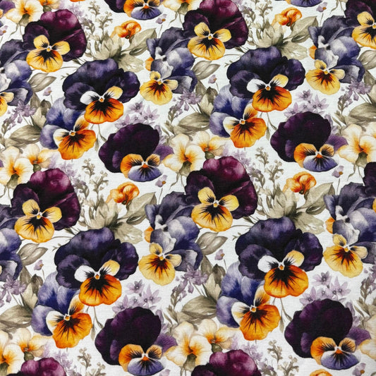 Nature's Fabrics cotton fabric with a purple and yellow pansy floral pattern.