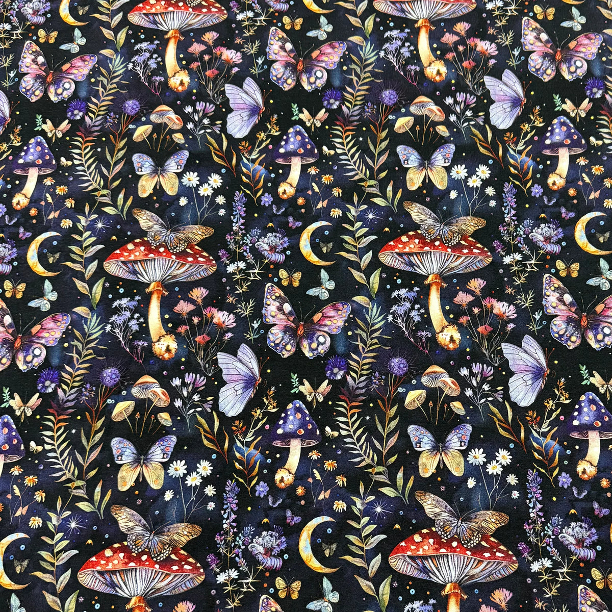 Nature's Fabrics enchanting mushroom & butterfly print fabric with flowers and moons on dark background