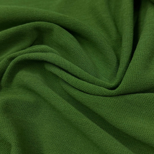 Rich green organic cotton fabric by Nature's Fabrics, showcasing soft texture and eco-friendly quality