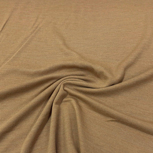 Tan organic cotton knit fabric by Nature's Fabrics, soft texture and natural drape for sewing projects