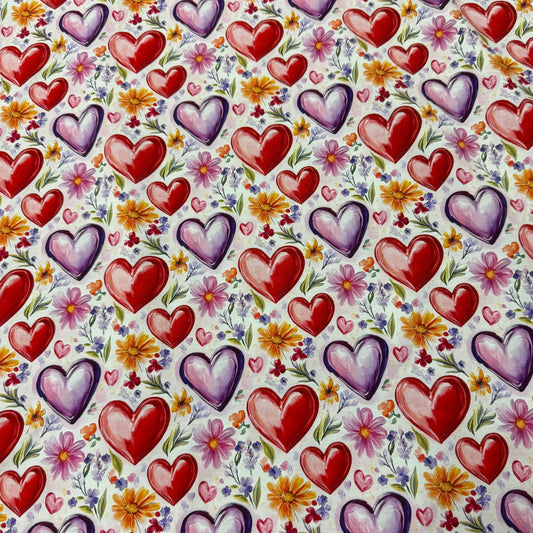Nature's Fabrics cotton fabric featuring a red and purple heart and floral pattern