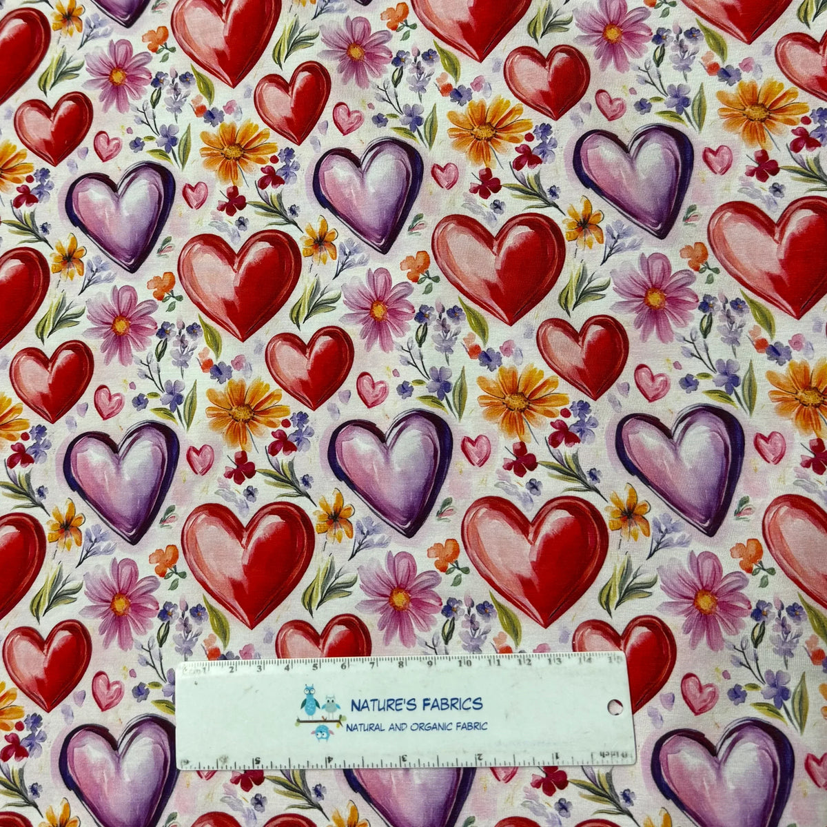 Nature's Fabrics red and purple heart floral print organic cotton fabric with ruler for scale