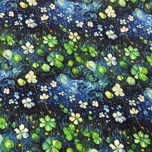 Nature's Fabrics organic cotton fabric featuring a starry night sky with clover and white flowers