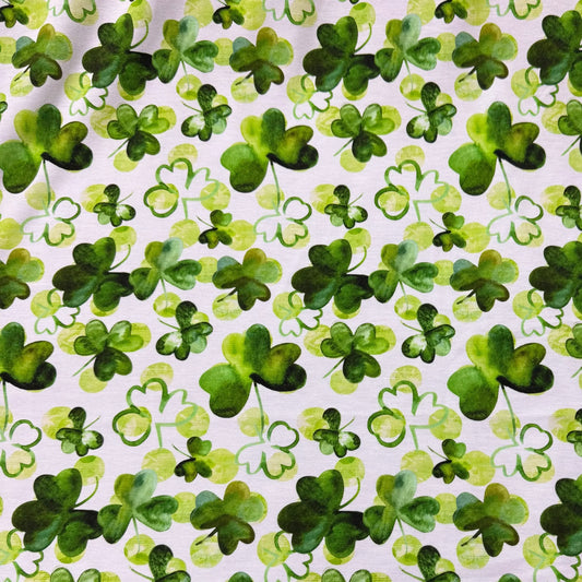 Nature's Fabrics white organic cotton fabric with green watercolor shamrock print