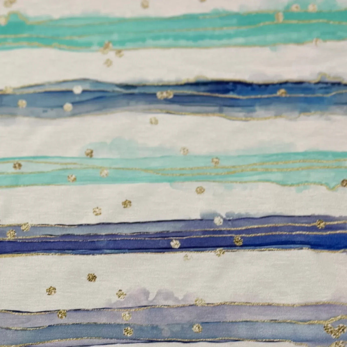 Nature's Fabrics watercolor stripe fabric with blue, teal, and gold accents on white background