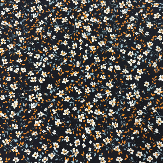 Nature's Fabrics navy blue fabric with a small white and yellow floral print