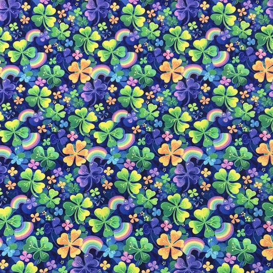 Nature's Fabrics pattern featuring colorful shamrocks and rainbows on a navy blue background.