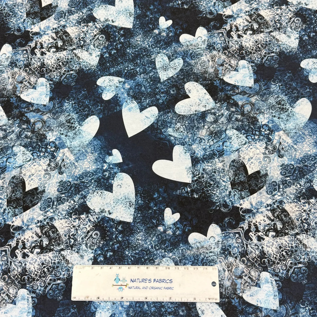 Nature's Fabrics blue and white heart pattern organic cotton fabric with swirl design, eco-friendly textile