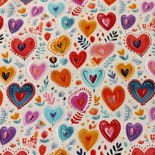 Nature's Fabrics organic cotton fabric with colorful hand-drawn hearts and floral patterns