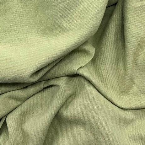Close-up of draped light green natural fabric from Nature's Fabrics
