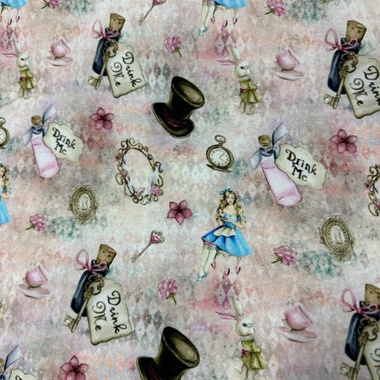 Nature's Fabrics Alice in Wonderland themed printed fabric with teacups, hats, and bottles.