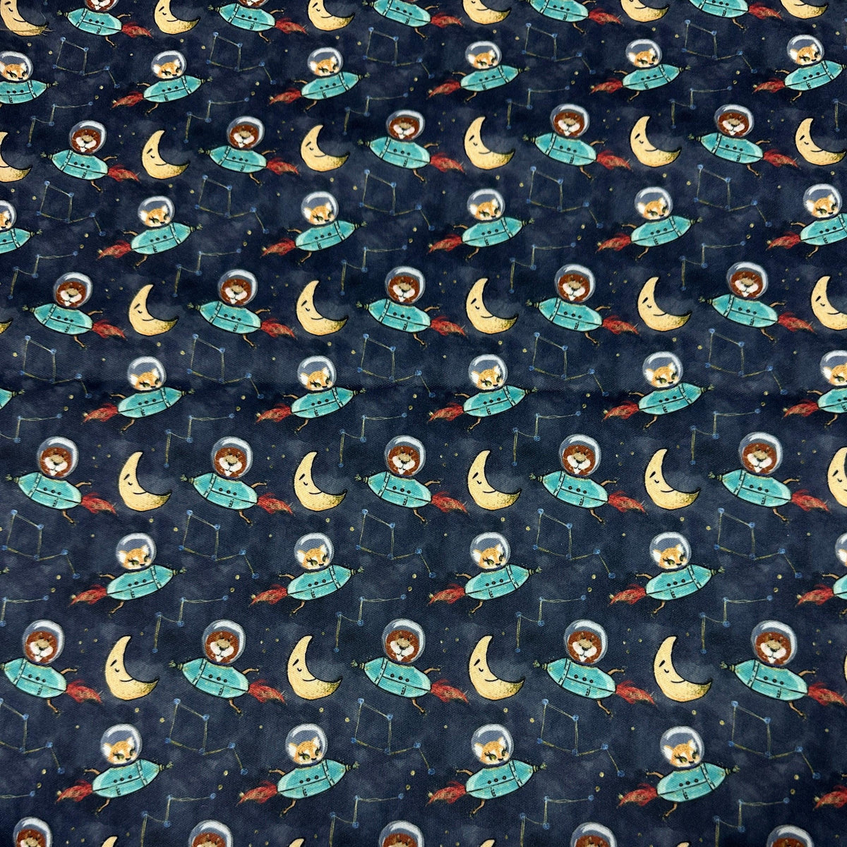 Nature's Fabrics dark blue fabric with cute astronaut and crescent moon pattern