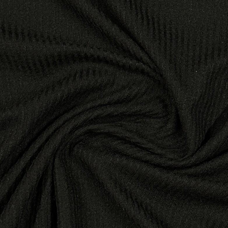 Close-up of black ribbed knit fabric from Nature's Fabrics.