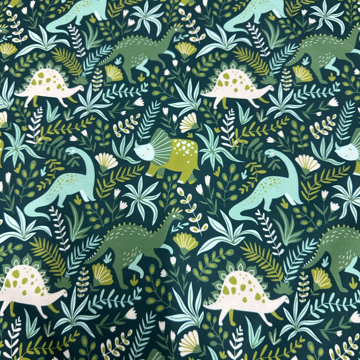 Dinosaurs on Green 1 mil PUL Fabric - Made in the USA - Nature's Fabrics