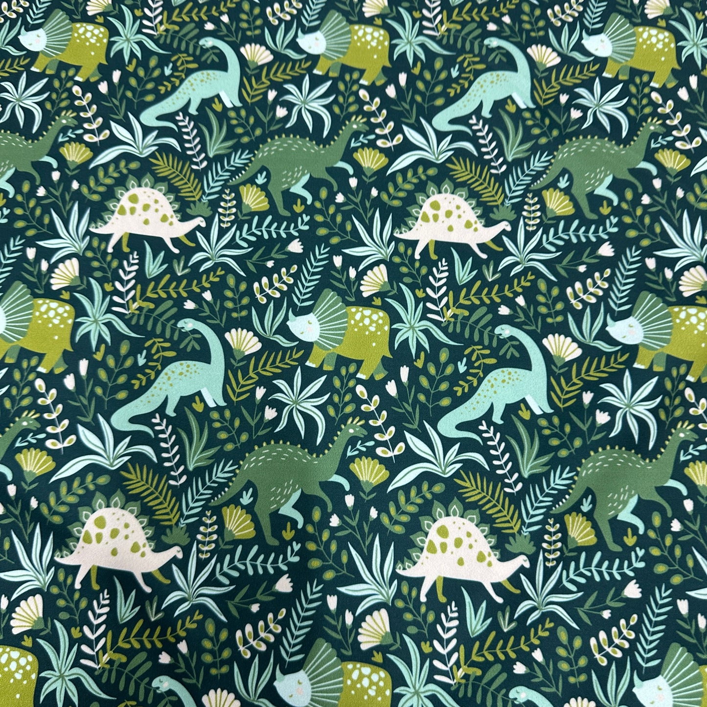 Dinosaurs on Green 1 mil PUL Fabric - Made in the USA - Nature's Fabrics