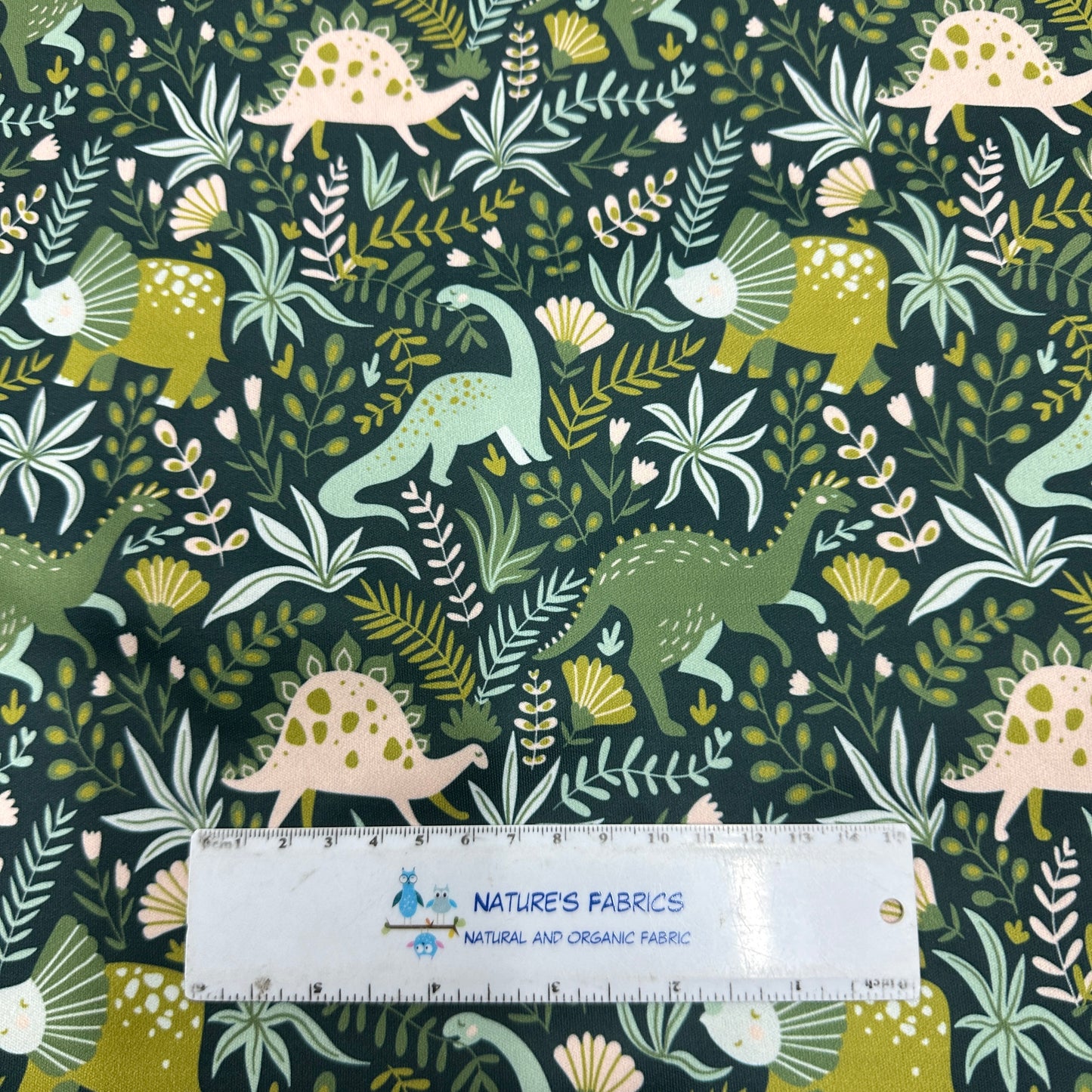 Dinosaurs on Green 1 mil PUL Fabric - Made in the USA - Nature's Fabrics