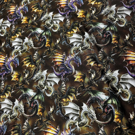 Nature's Fabrics dragon print fabric with purple and silver mythical creatures