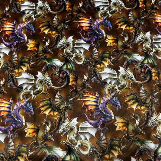 Nature's Fabrics brown textile featuring a pattern of multicolored fantasy dragons.