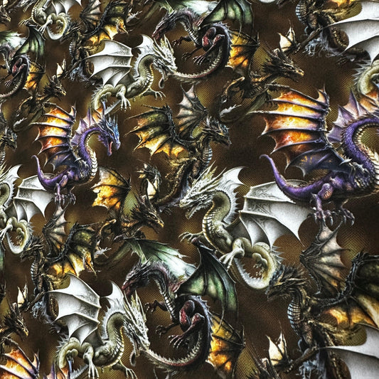 Nature's Fabrics print featuring various colorful fantasy dragons on a dark background.