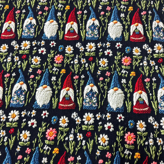 Nature's Fabrics embroidered fabric featuring colorful garden gnomes and floral patterns