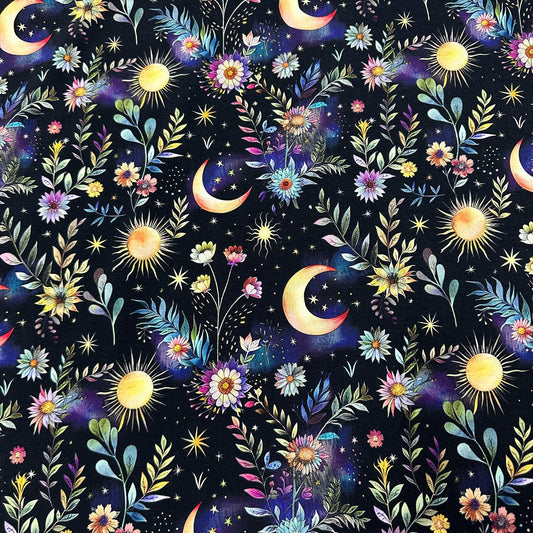 Nature's Fabrics celestial pattern fabric with crescent moons, suns, and floral botanical art.