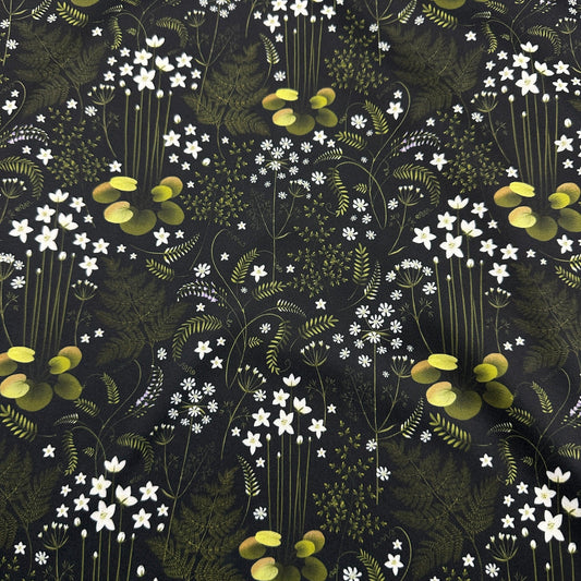 Nature's Fabrics dark floral print fabric featuring white wildflowers and green lily pads.