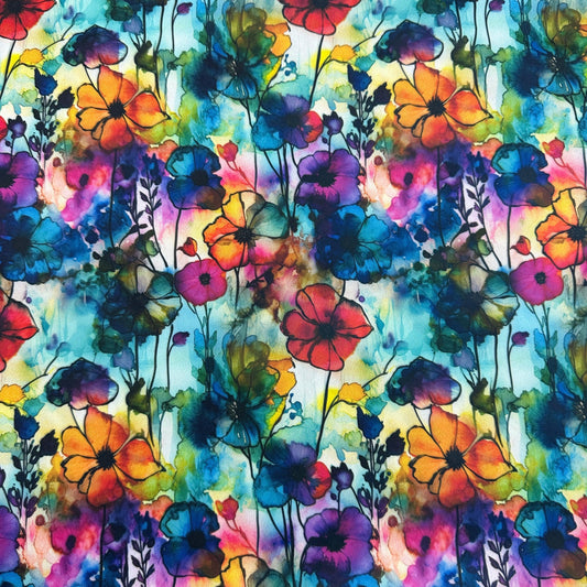 Nature's Fabrics colorful watercolor floral pattern with vibrant red, blue, and orange flowers