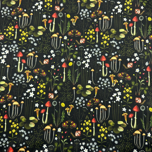 Nature's Fabrics botanical print fabric featuring colorful mushrooms, snails, and wildflowers.