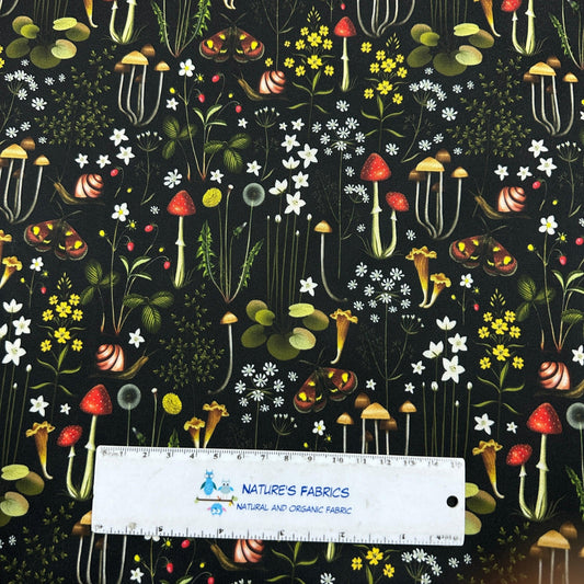 Nature's Fabrics organic cotton fabric with forest mushrooms and snails pattern.