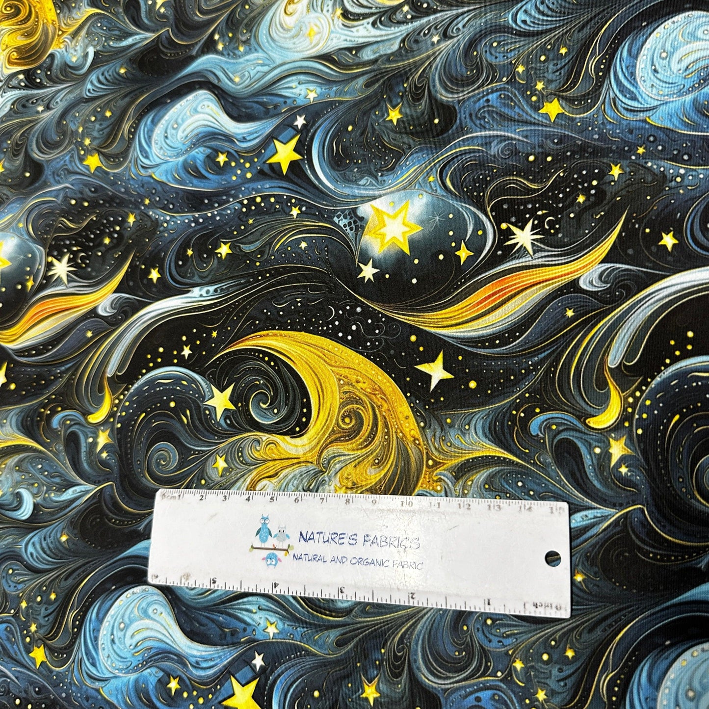 Golden Starry Sky on Polyester/Spandex Tricot Fabric - Nature's Fabrics