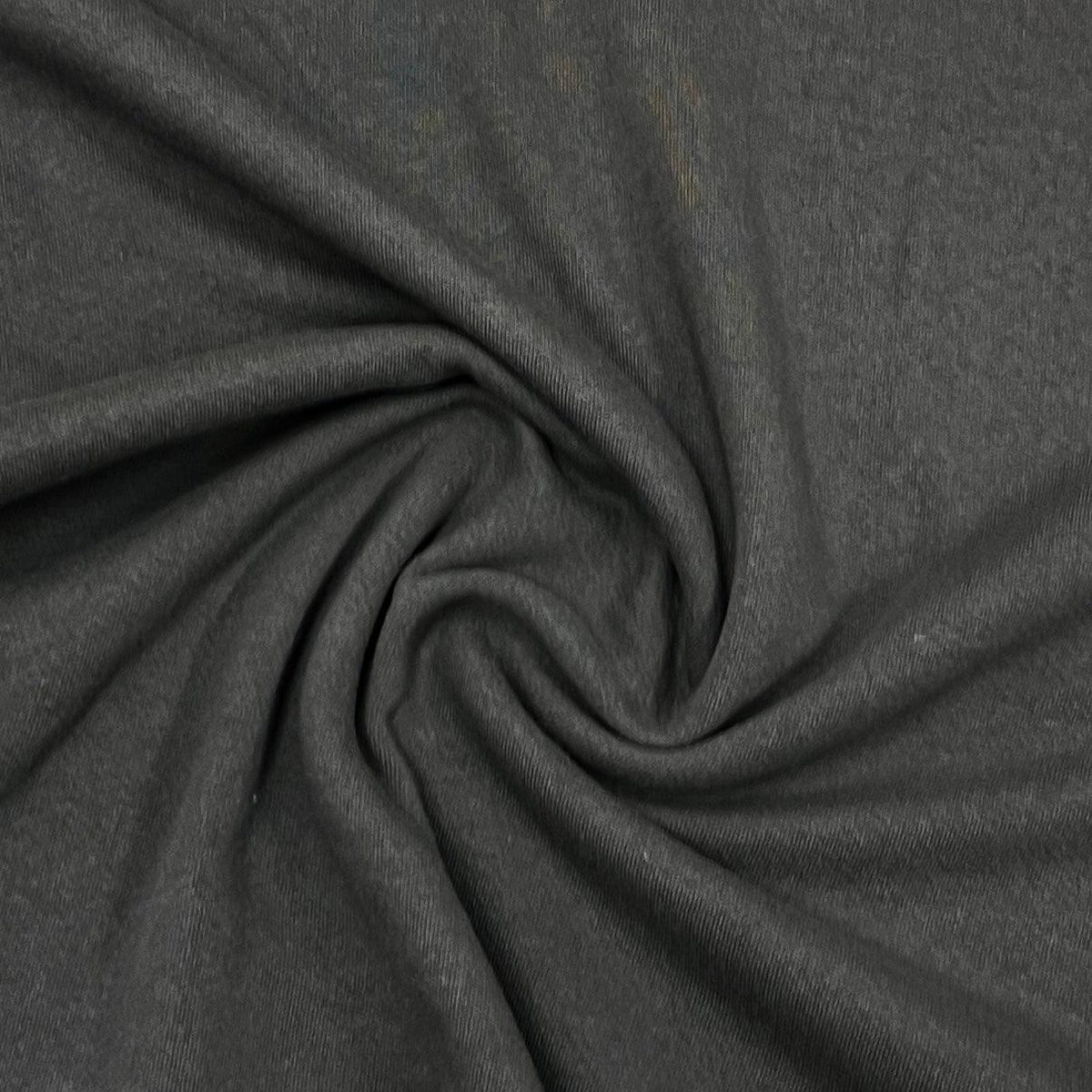 Dark grey premium natural fabric from Nature's Fabrics draped in a spiral pattern