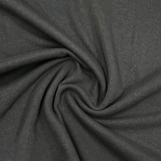 Dark grey premium natural fabric from Nature's Fabrics draped in a spiral pattern