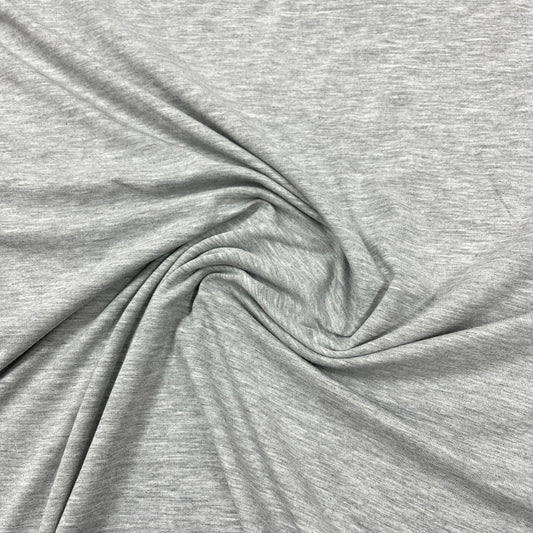 Nature's Fabrics light grey heathered organic cotton fabric with soft folds.
