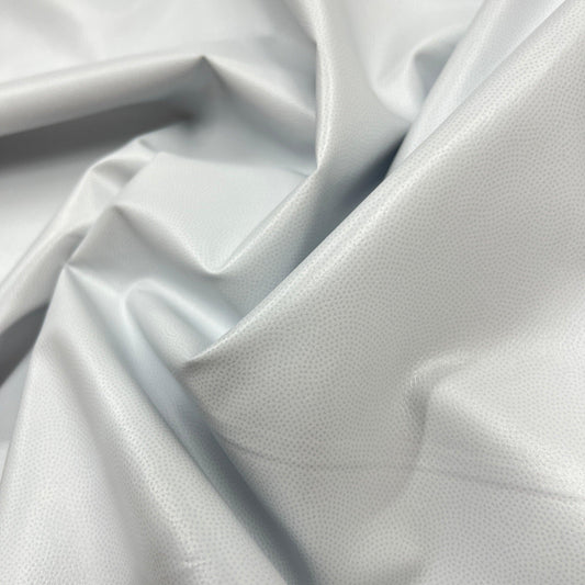 Close-up of draped white textured fabric from Nature's Fabrics