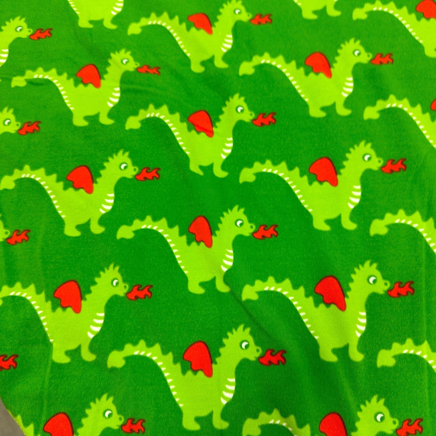 Green Dragons on Green Organic Cotton/Spandex Jersey Fabric - Nature's Fabrics