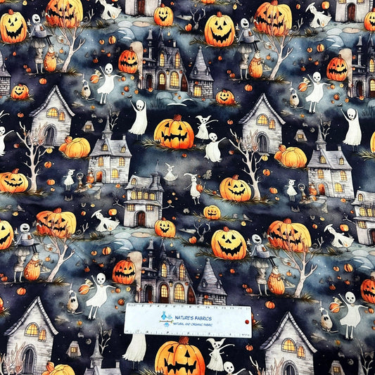 Halloween patterned fabric by Nature's Fabrics featuring ghosts, pumpkins, and haunted houses.