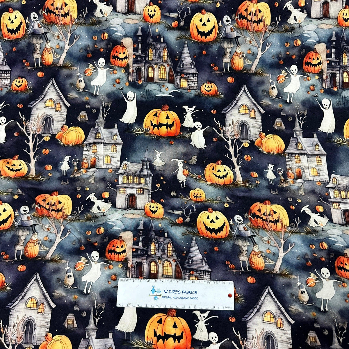 Nature's Fabrics Halloween patterned fabric with pumpkins, ghosts, and haunted houses.