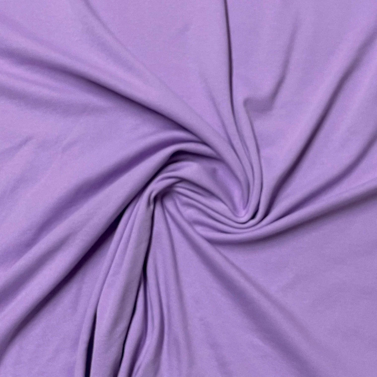 Purple natural fabric draped in a spiral by Nature's Fabrics