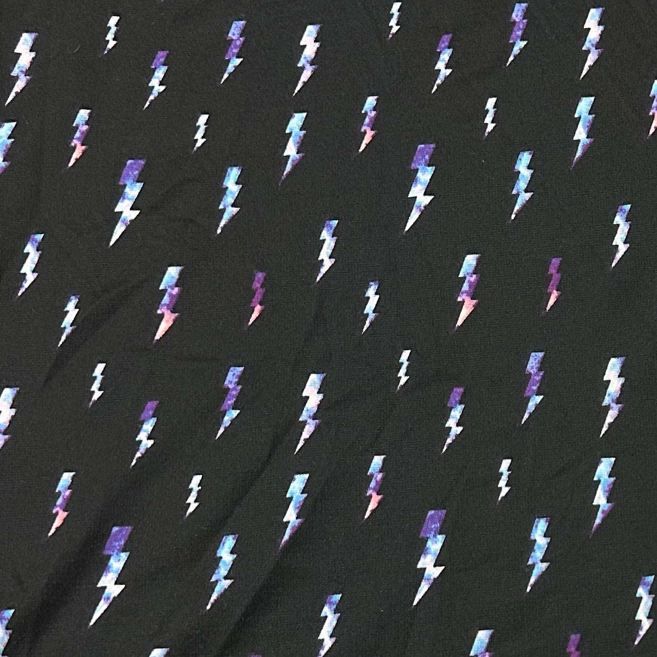 Lightning on Black Poly Blend Interlock Fabric - Nature's Fabrics