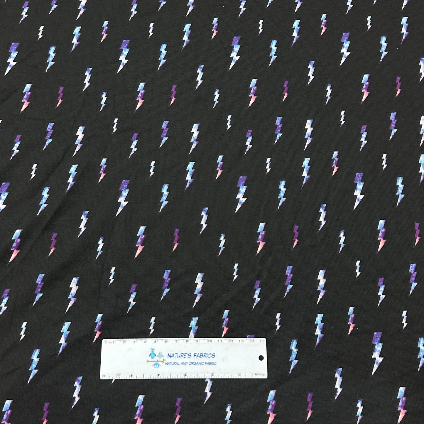 Lightning on Black Poly Blend Interlock Fabric - Nature's Fabrics