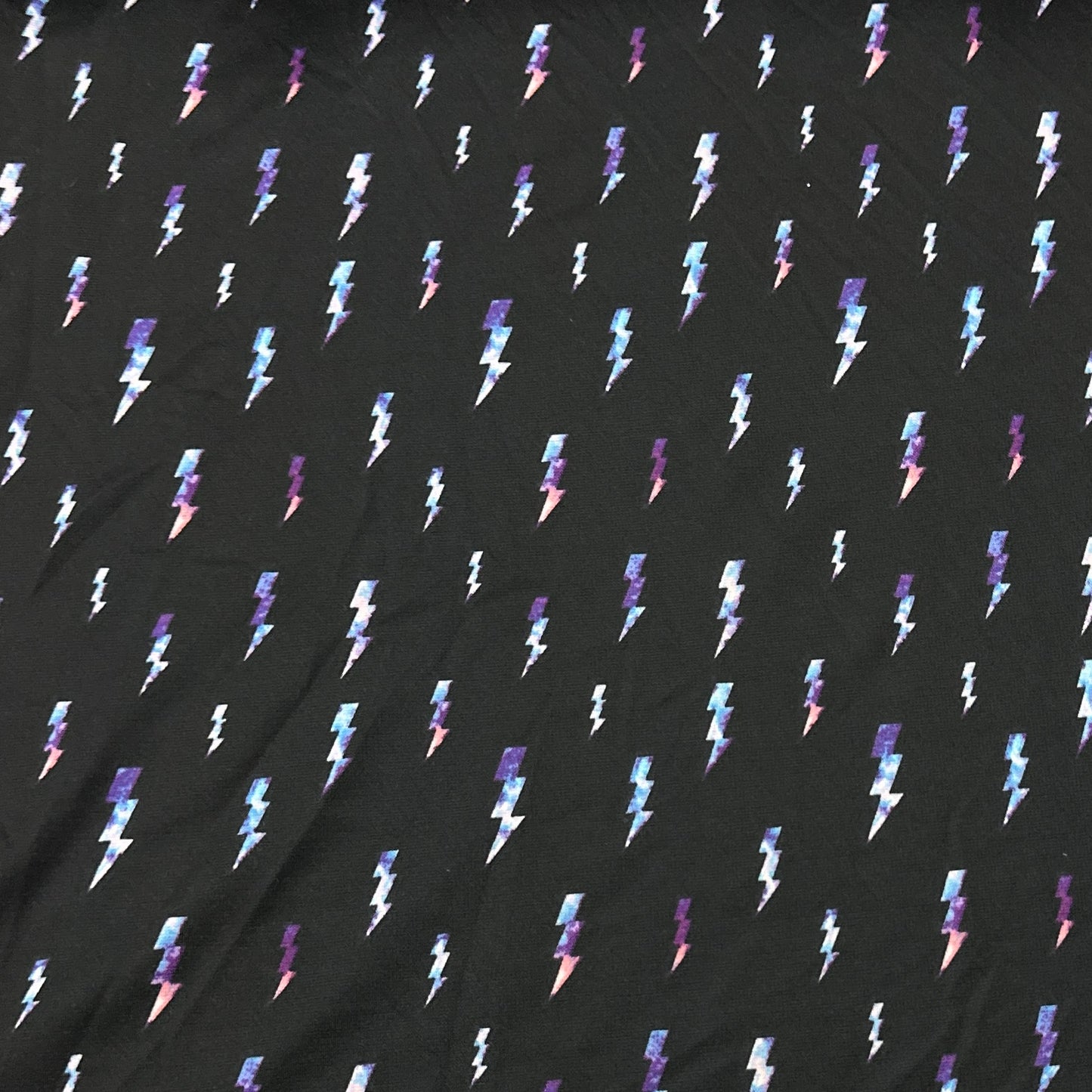 Lightning on Black Poly Blend Interlock Fabric - Nature's Fabrics