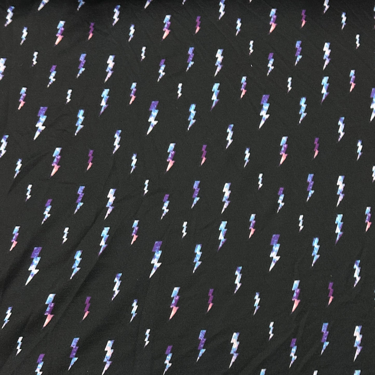 Lightning on Black Poly Blend Interlock Fabric - Nature's Fabrics