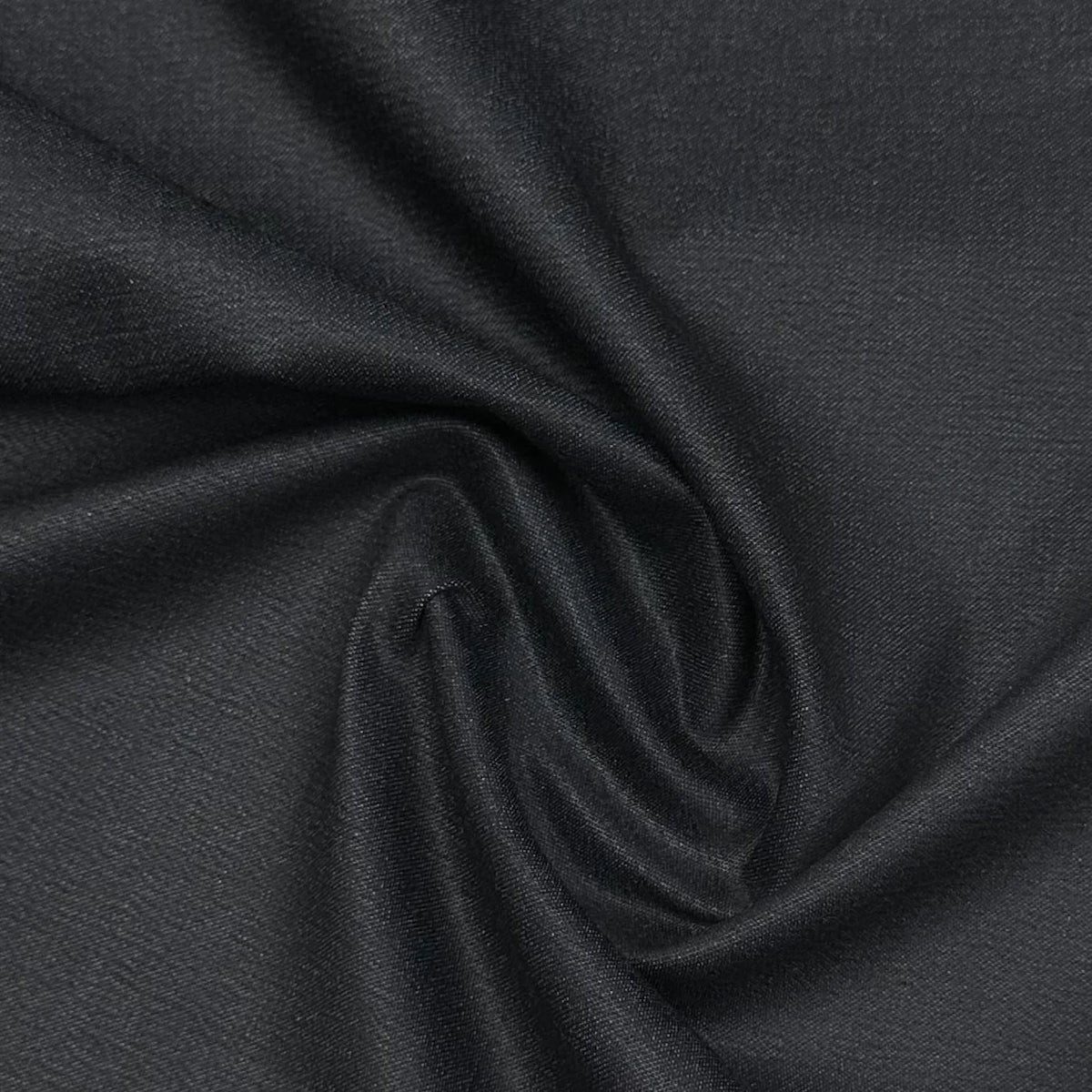 Close-up of draped black premium natural fabric from Nature's Fabrics