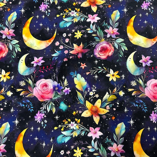 Nature's Fabrics celestial pattern with crescent moons and colorful flowers on dark blue background