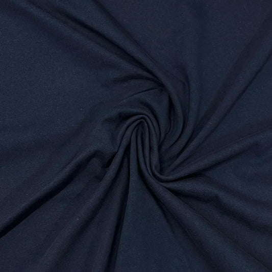 Nature's Fabrics navy blue organic fabric draped in a spiral pattern