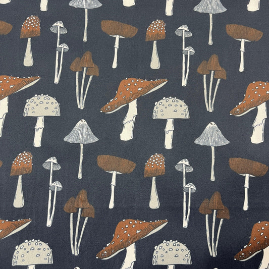 Nature's Fabrics dark blue cotton fabric with a variety of brown and white mushroom patterns.