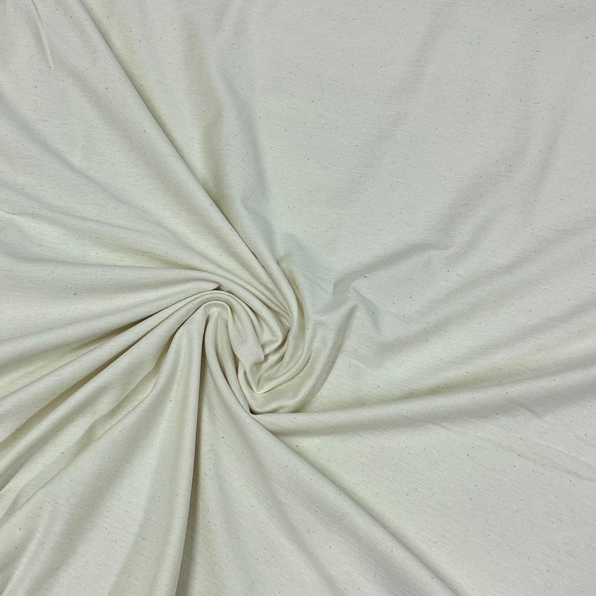 Swirled cream-colored organic cotton fabric from Nature's Fabrics