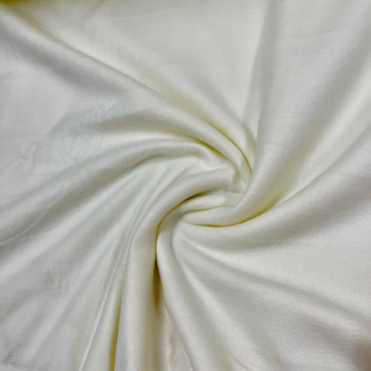 Close-up of swirled white organic fabric from Nature's Fabrics.